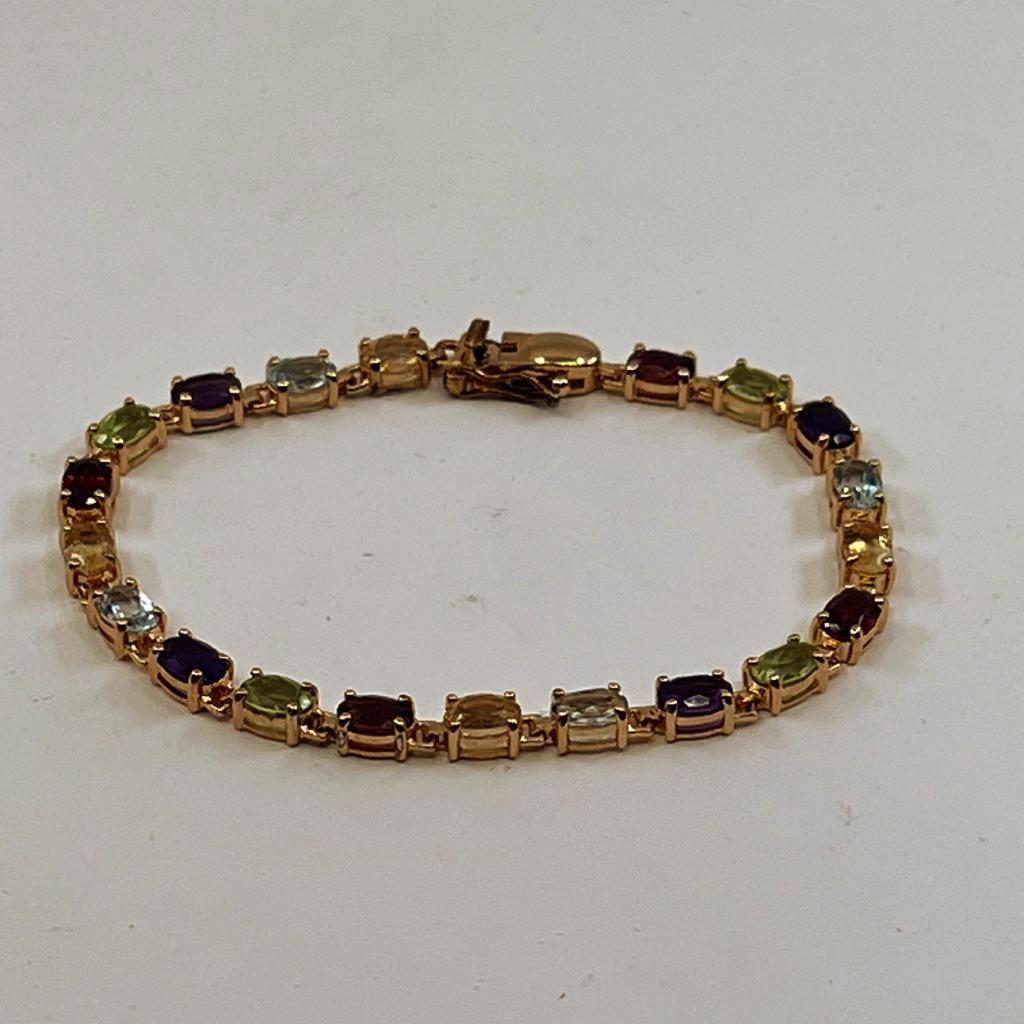 MULTI-GEM OVAL SHAPED STONES