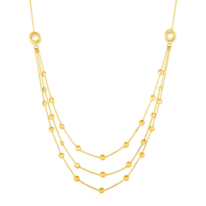 Station Necklace with Three Chains and Love Knots in 14k Yellow Gold